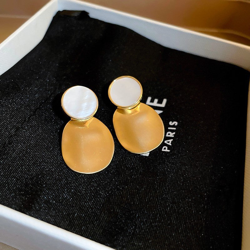 Golden Pleated Oval Stud Earrings with White Shell Pearl Accent | Blanqor